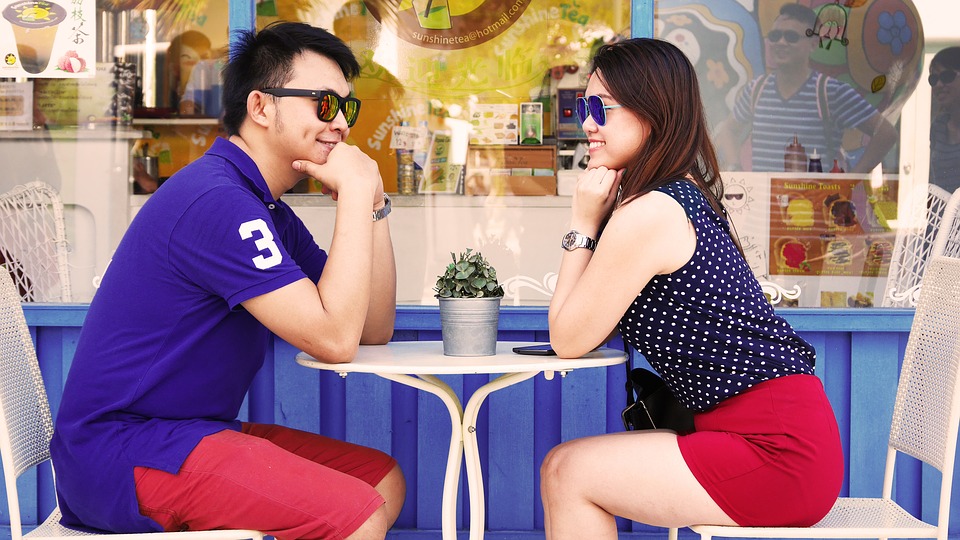 Couple sitting at table on date